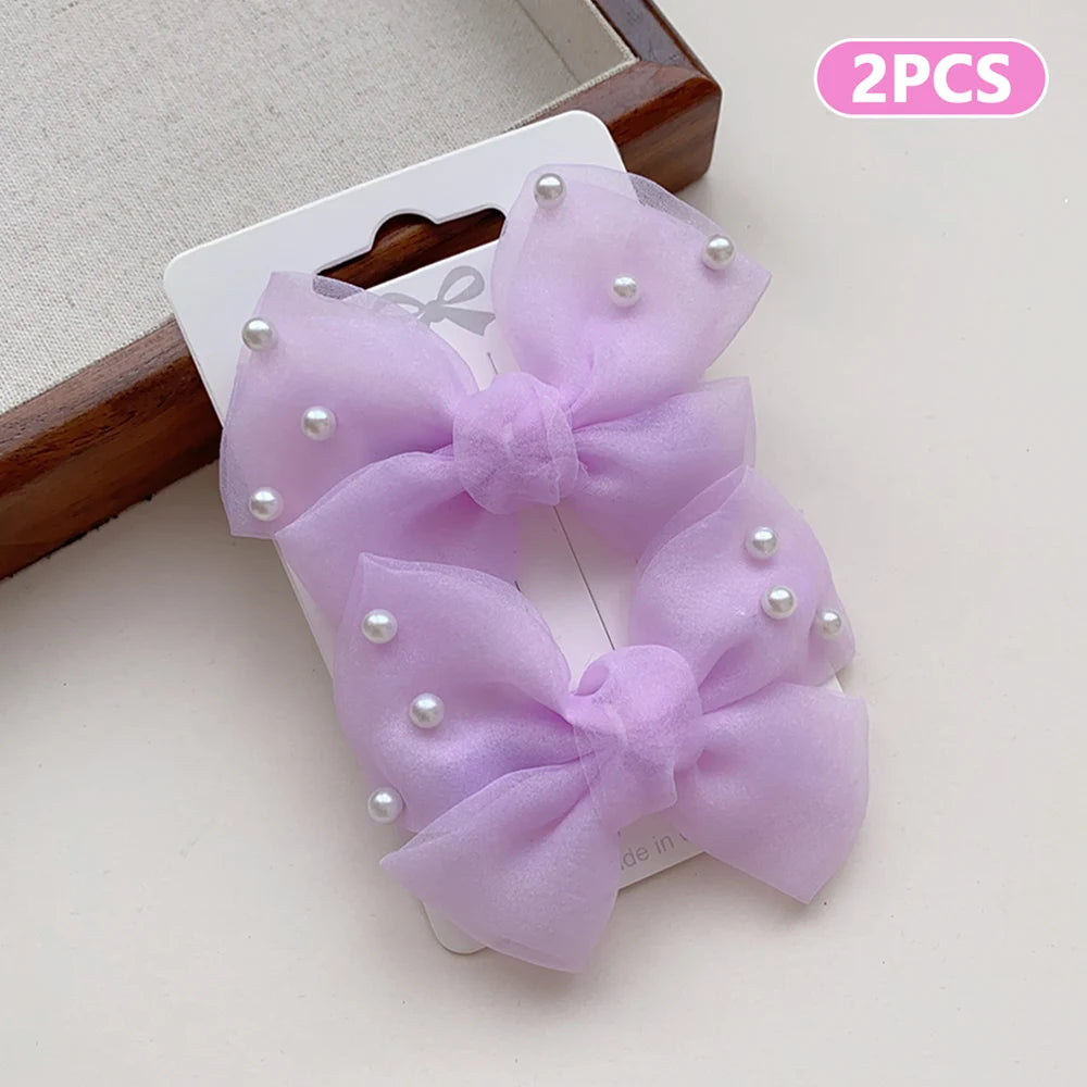 2 Pieces of Cute Multi-Coloured Bow Hair Clips for Girls with Faux Pearls, Suitable for Dressing up and Everyday Wear pretty party’s