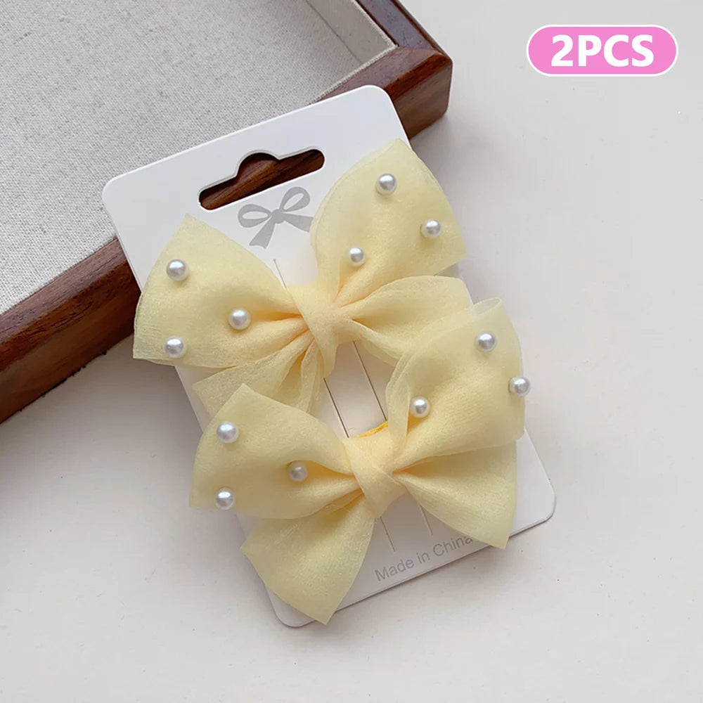 2 Pieces of Cute Multi-Coloured Bow Hair Clips for Girls with Faux Pearls, Suitable for Dressing up and Everyday Wear pretty party’s