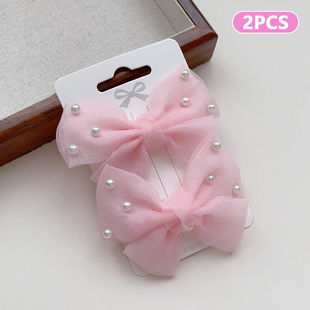 2 Pieces of Cute Multi-Coloured Bow Hair Clips for Girls with Faux Pearls, Suitable for Dressing up and Everyday Wear pretty party’s